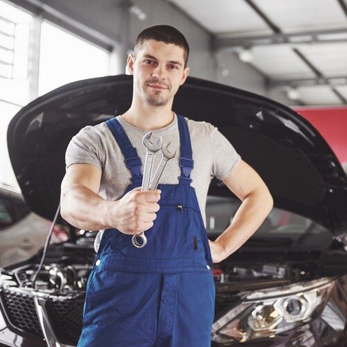 car mechanic with wrench garage