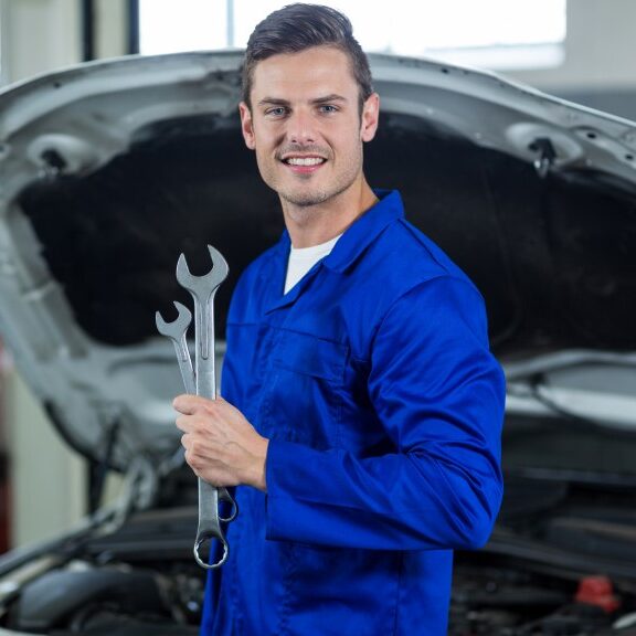 mechanic holding wrench