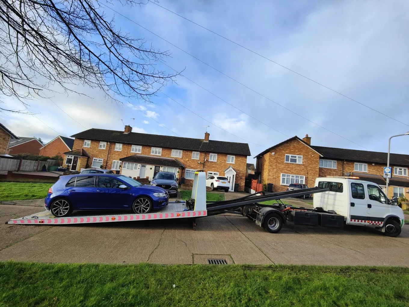 Volkswagen Golf R being transported on a recovery truck.