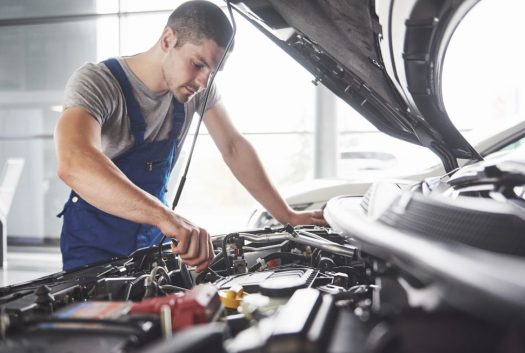 mechanic doing battery service at Tow U Away